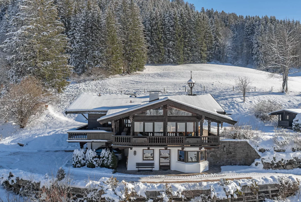 Reith bei Kitzbühel in Austria - a house in the middle of a snowy landscape.