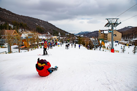 A vibrant winter scene at the ski resort in Visperterminen Switzerland. Highlighting the active ski lift against the backdrop of a pristine snow-covered landscape where winter sports enthusiasts frolic.