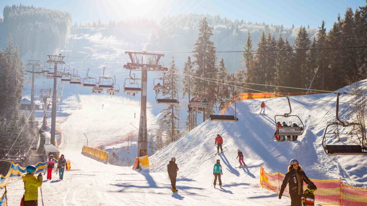 Tsaghkadzor in Armenia - a group of people skiing down a ski slope.