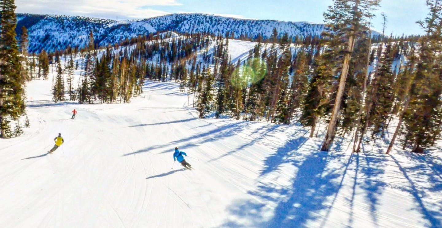Monarch in USA - a person skiing down a slope in the mountains.