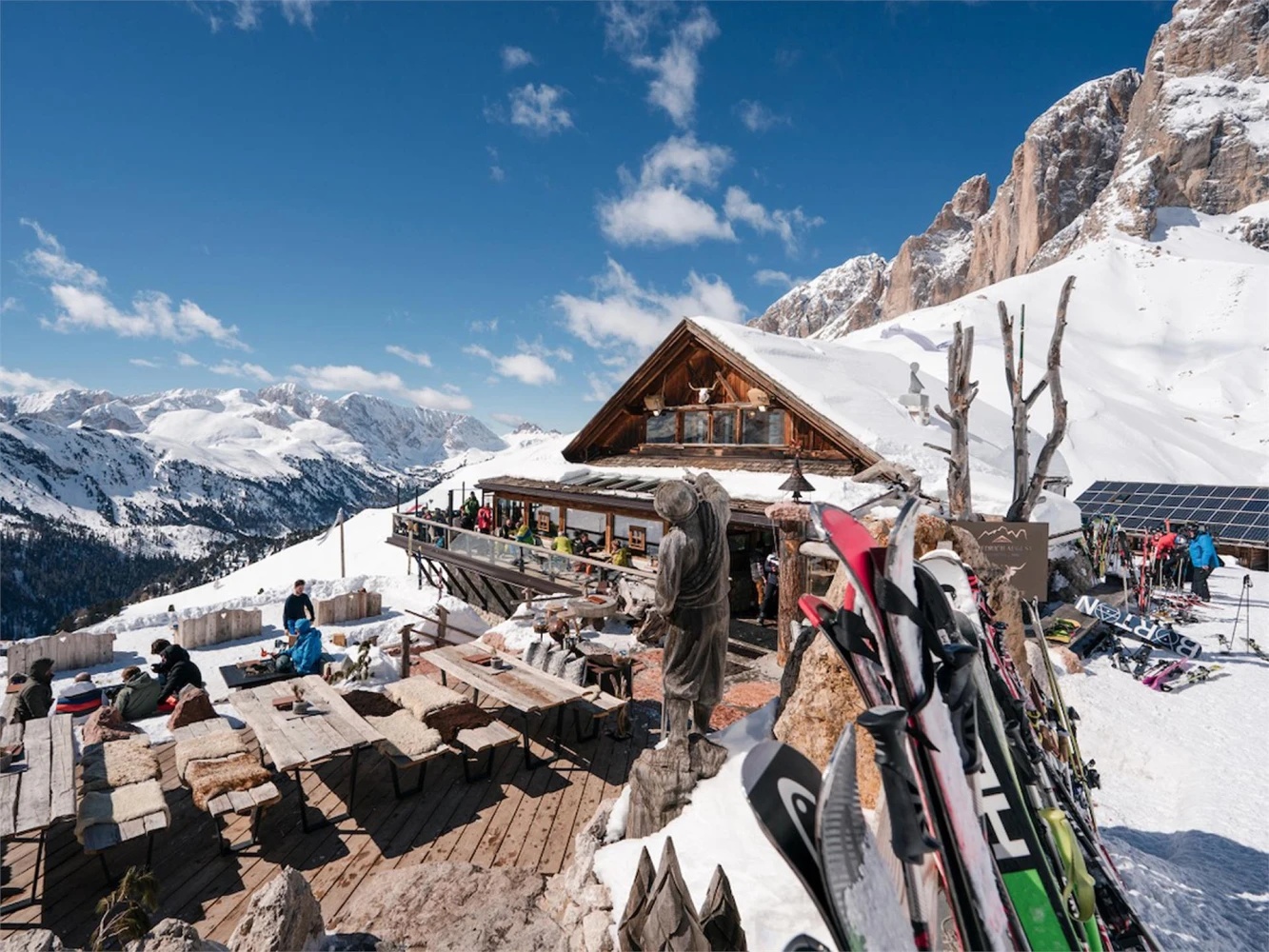 Altopiano di Brentonico in Italy - a group of people standing on top of a mountain.