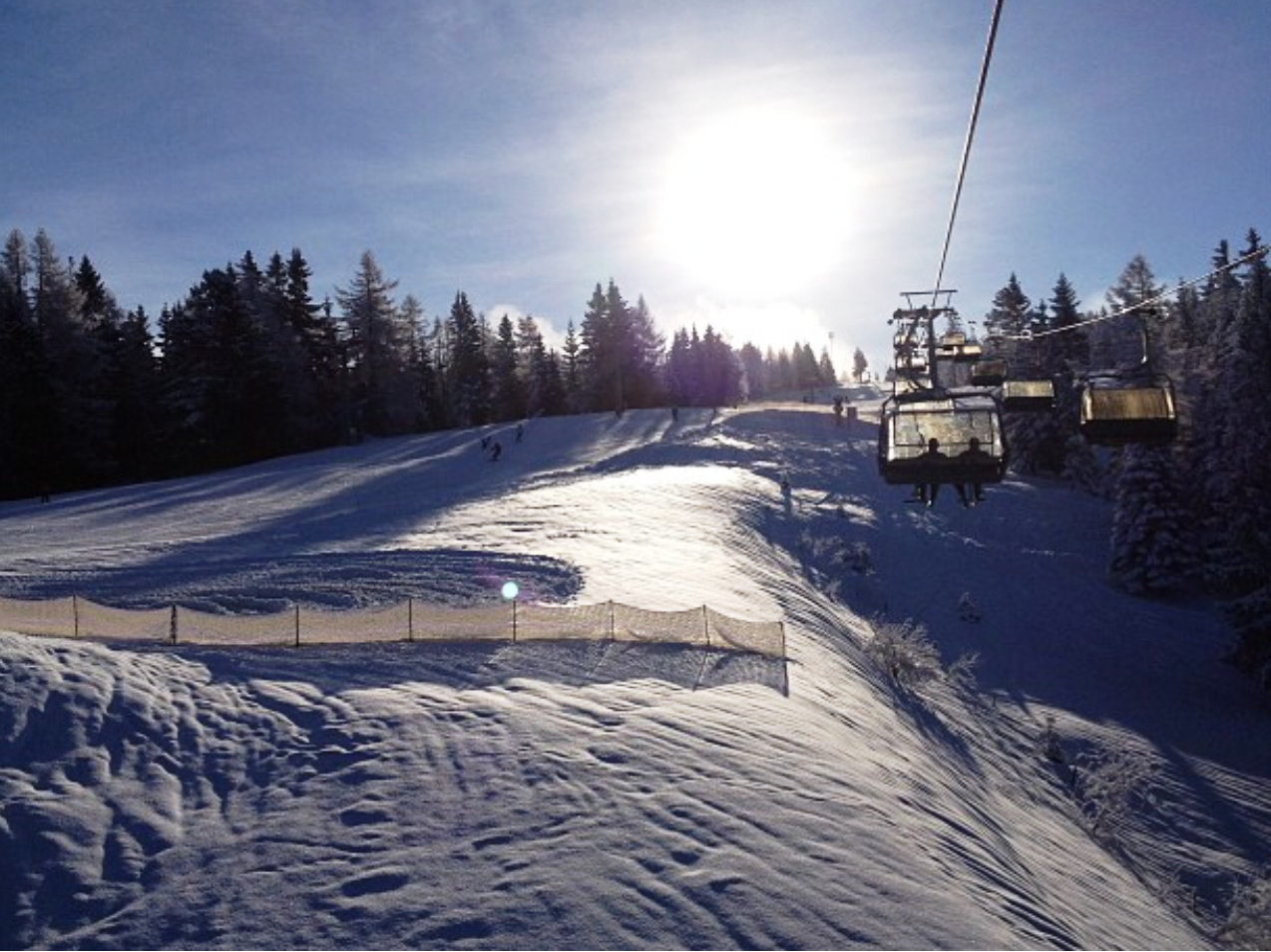 Cerkno in Slovenia - the sun is shining over the snow covered slopes.