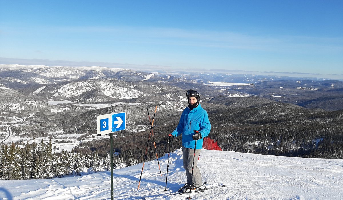 Mont Edouard – L'Anse-Saint-Jean in Canada - a man standing on top of a snow covered mountain.