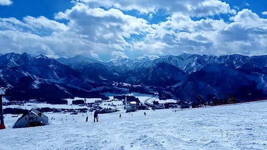 Winter sports enthusiasts enjoy skiing at Iwappara ski resort in Yuzawa, Niigata, Japan, wrapped in a stunning winter landscape.