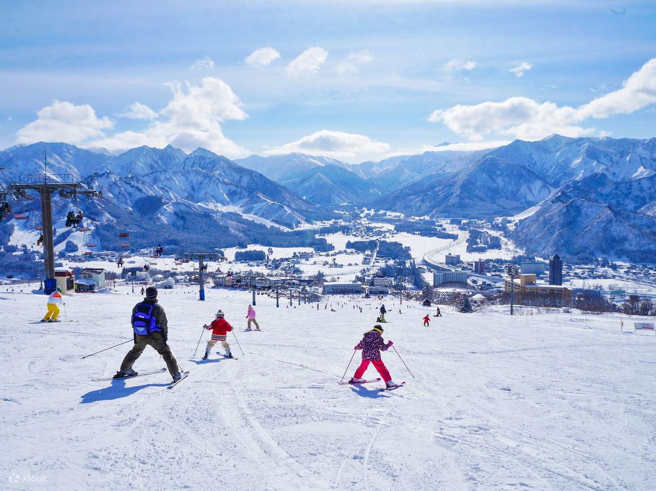 Iwappara in Japan - a group of people skiing down a snowy slope.