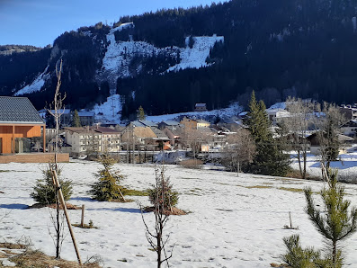 Image depicting a charming chalet at Mijoux - La Faucille ski resort in France. The winter scene is adorned with a beautiful snowscape, accentuating the charm of winter sports activities.