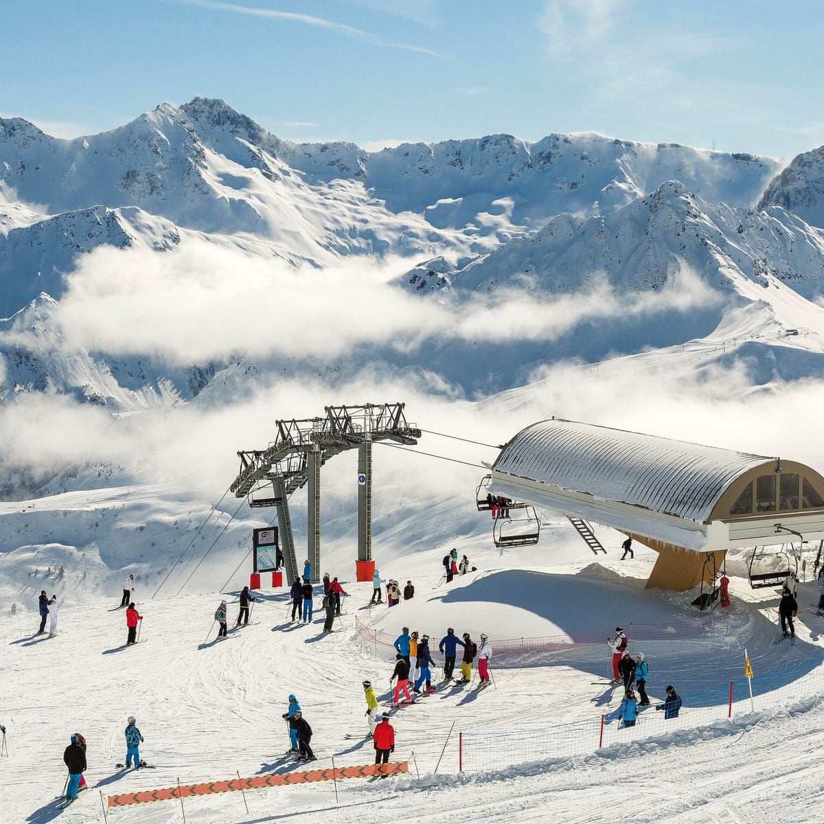 Mijoux - La Faucille in France - a group of people skiing on top of a mountain.