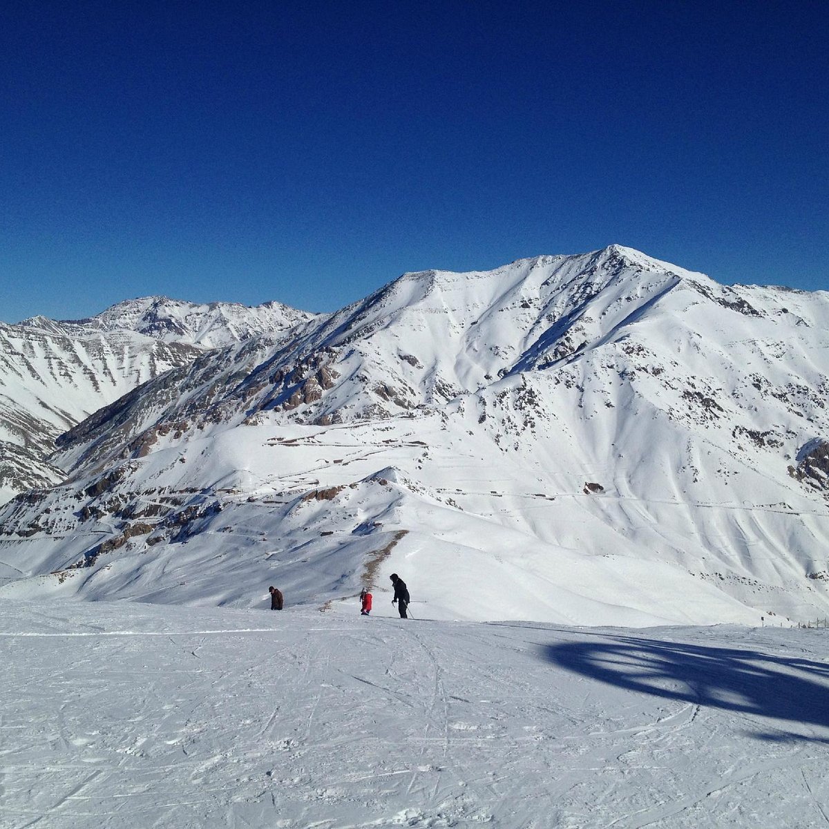 Dizin International in Iran - a person skiing down a snowy mountain.
