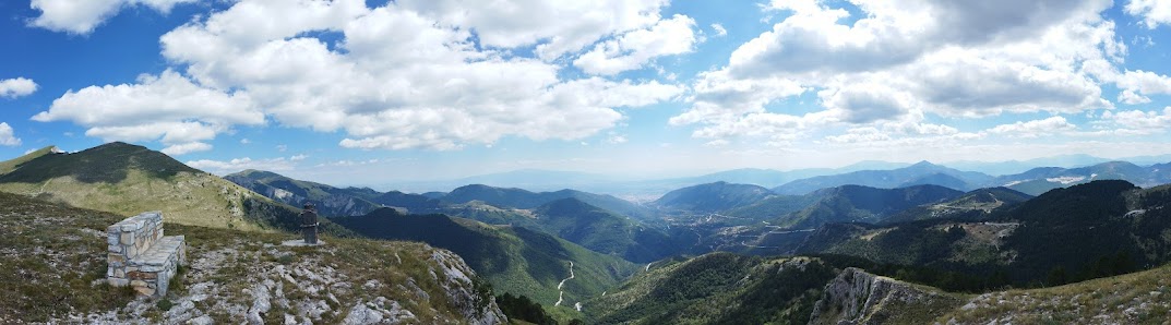 A beautiful chalet sits nestled against the backdrop of Falakro mountain in Eastern Macedonia Greece under a clear sunny sky.