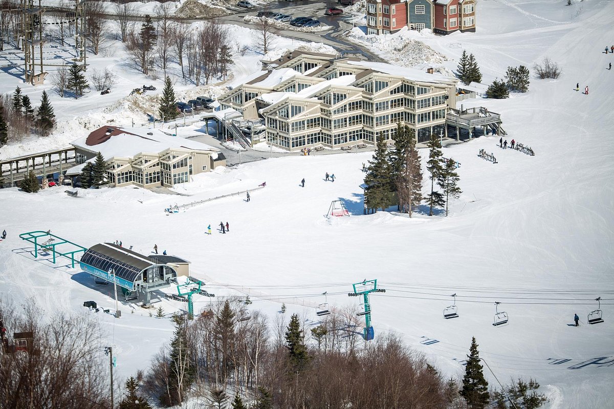 Marble Mountain in Canada: an aerial view of a ski resort surrounded by trees.