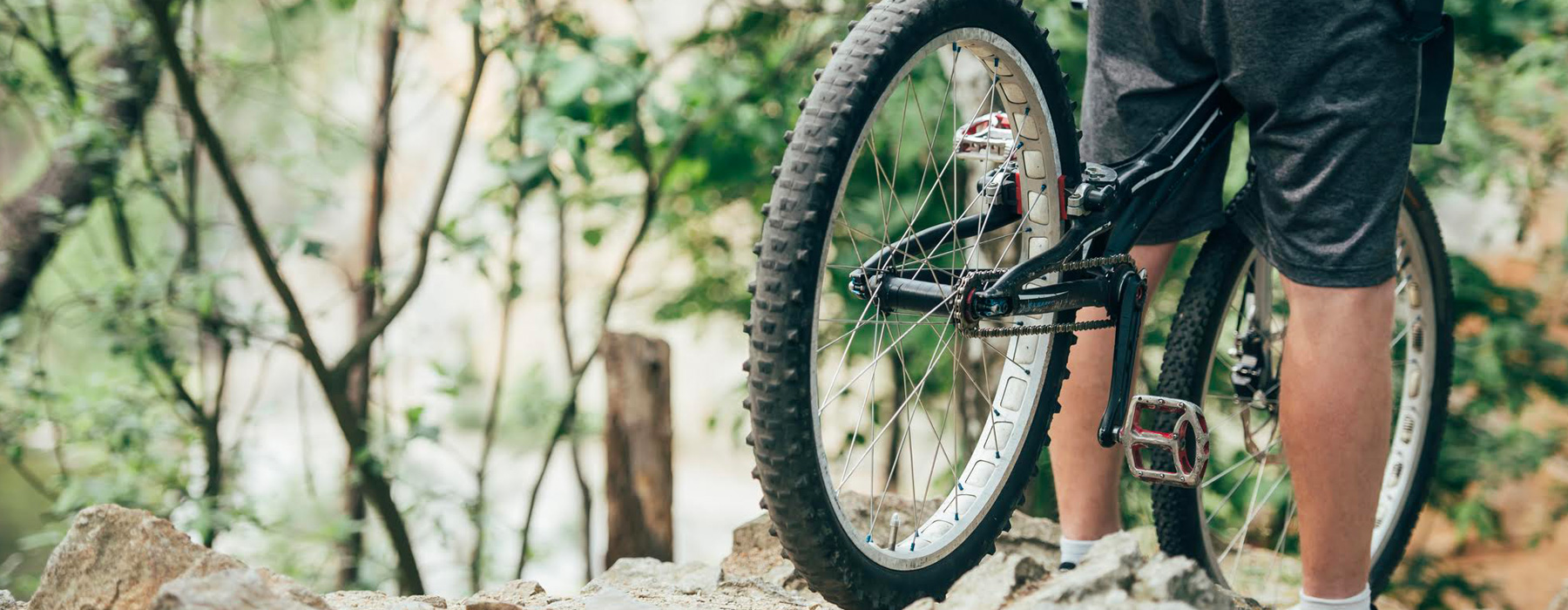 A mountain biker enjoying a ride at Mont Orignal in Lac-Etchemin Quebec Canada on a clear day.