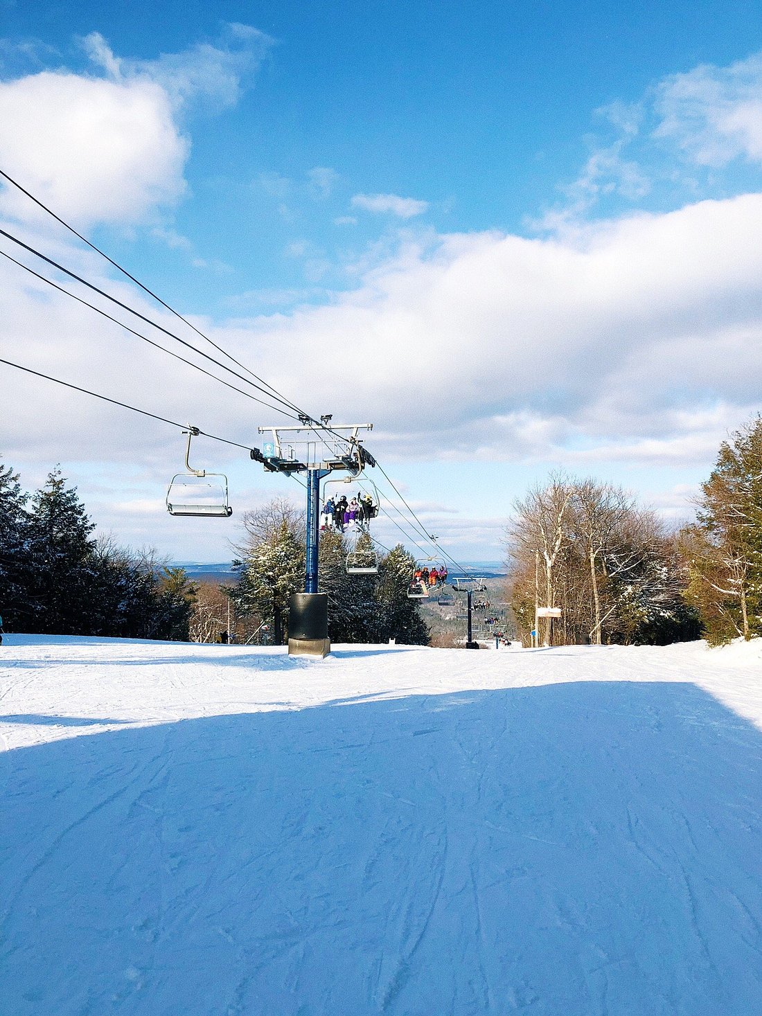 Wachusett Mountain Ski Area in USA - a person riding a ski board on a snowy slope.