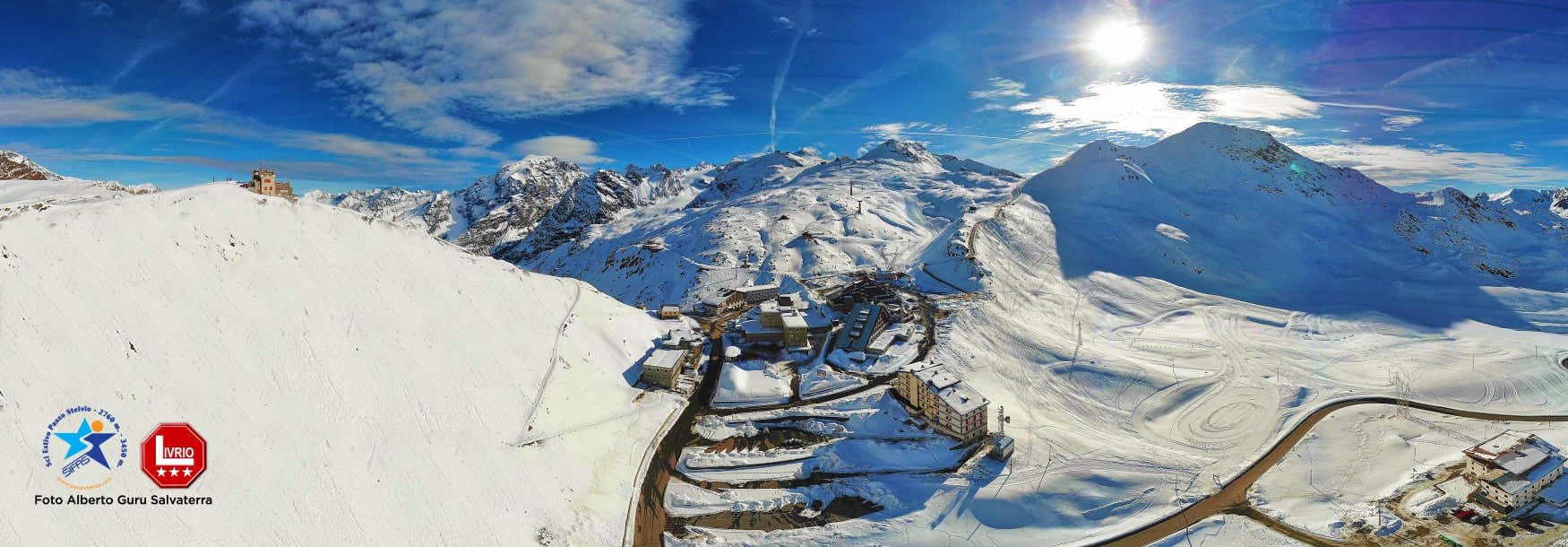 Passo dello Stelvio in Italy - a view from the top of a snowy mountain.