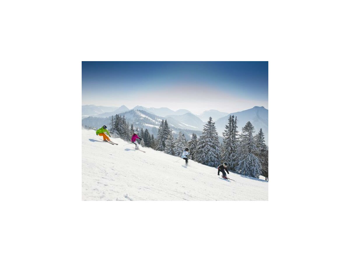 Gaissau-Hintersee in Austria - a group of people skiing down a mountain.