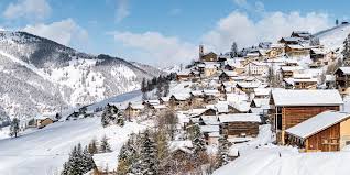 Image of a charming chalet nestled amid the stunning winter scenery of Molines-en-Queyras, Saint-Véran in Hautes-Alpes, France. The bustling winter sports scene and ski resort add to the vibrant atmosphere.
