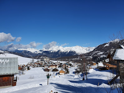 Image of a charming chalet at the Albiez-Montrond ski resort in France, showcasing an idyllic winter landscape filled with winter sports activities.