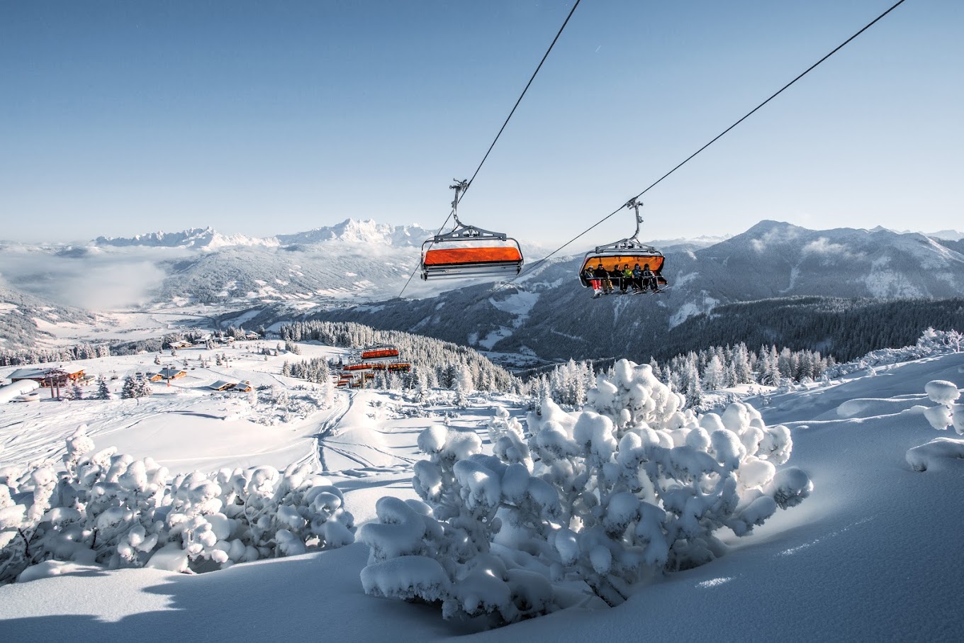 Snow Space Salzburg in Austria - a ski lift going up a snowy mountain.