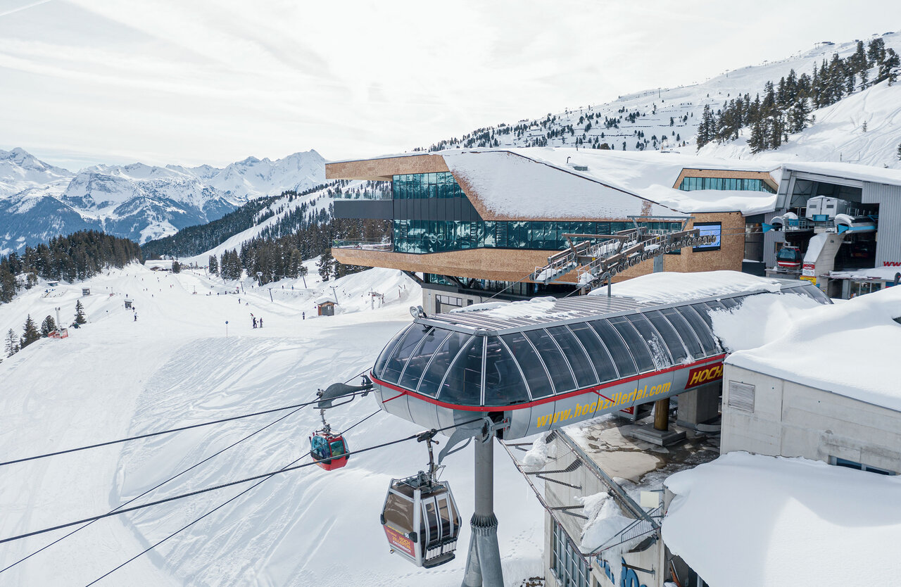 Hochzillertal | Hochfügen in Austria - a ski lift going up a snowy hill.