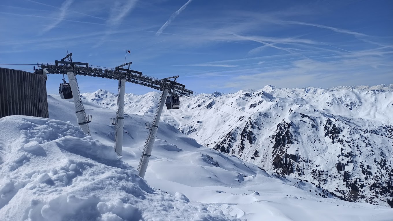 Hochzillertal | Hochfügen in Austria - a ski lift going up the side of a mountain.