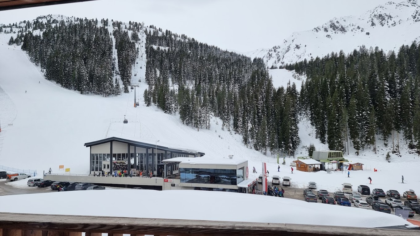 Hochzillertal | Hochfügen in Austria - a view of a ski slope from a window.