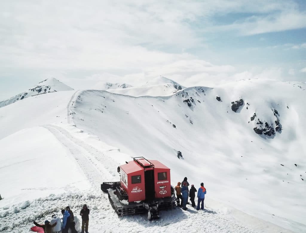 Popova Sapka in North Macedonia - a group of people standing on top of a snowy mountain.