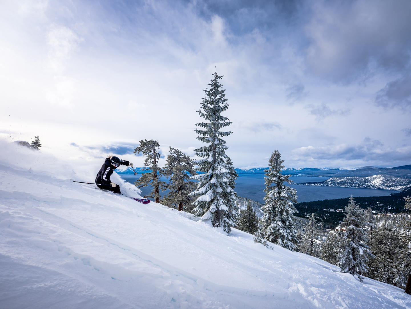 Diamond Peak in USA - a person riding a snowboard down a snowy slope.