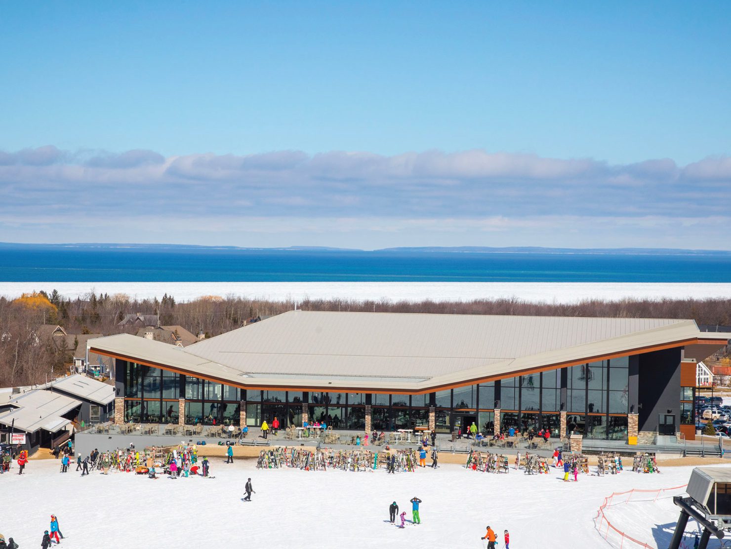 Alpine Ski Club – Collingwood in Canada - a group of people skiing on a snow covered slope.