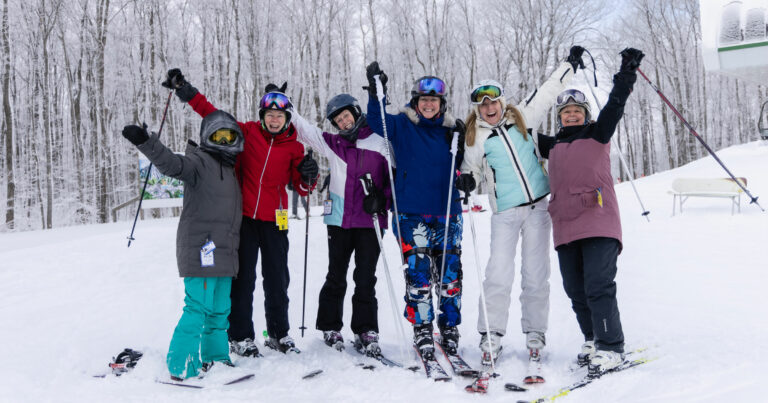 Alpine Ski Club – Collingwood in Canada - a group of people posing for a picture in the snow.
