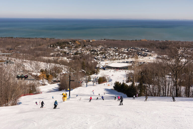 Alpine Ski Club – Collingwood in Canada - a group of people skiing down a hill.