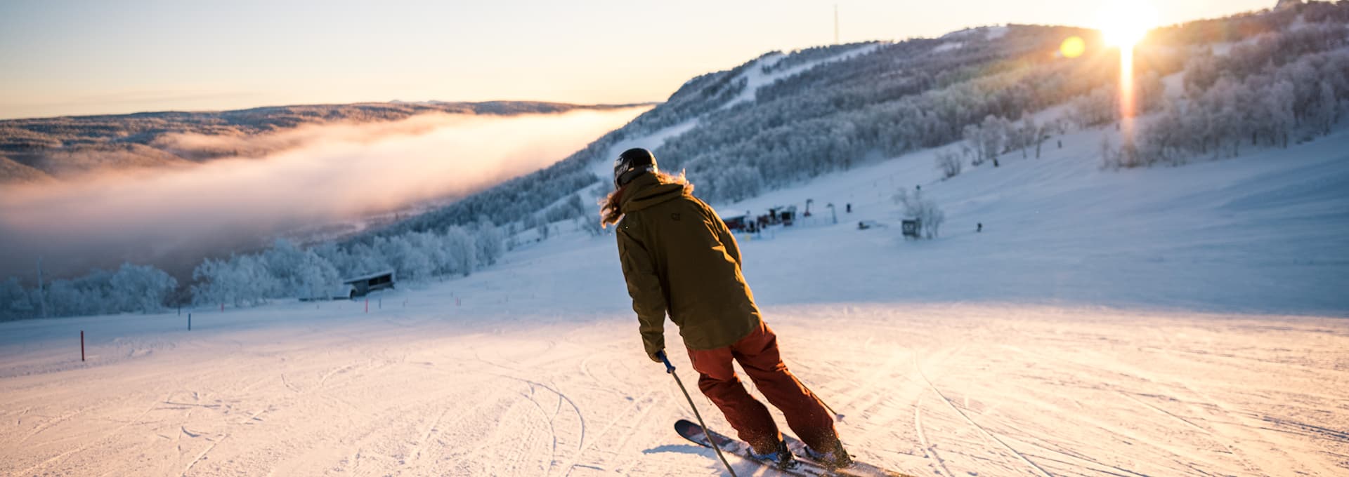 Ramundberget in Sweden - a person is skiing down a snowy hill.