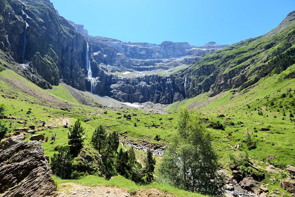 Station de ski Gavarnie-Gèdre in France - a small waterfall in the middle of a valley.