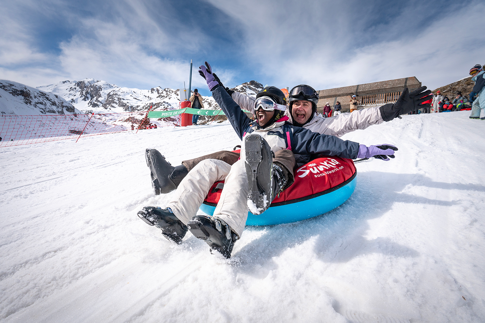 Station de ski Gavarnie-Gèdre in France - a person on a snow tube in the snow.