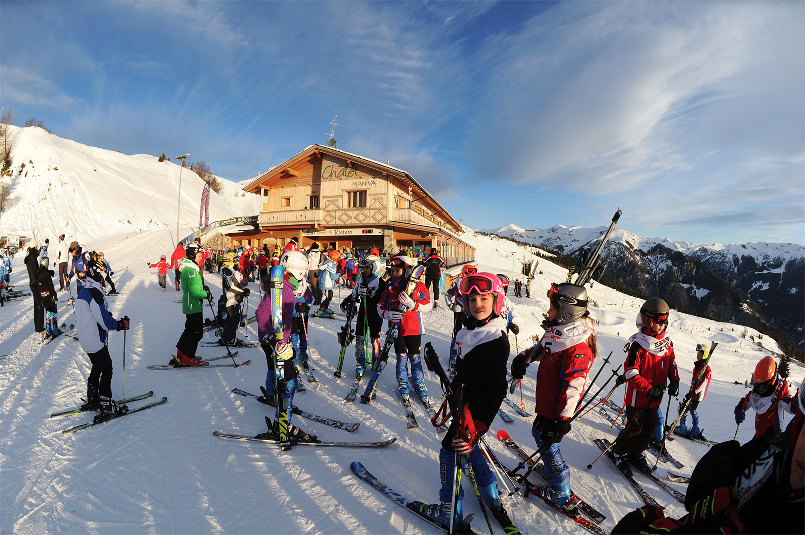 Passo Maniva in Italy - a large group of people skiing down a mountain.
