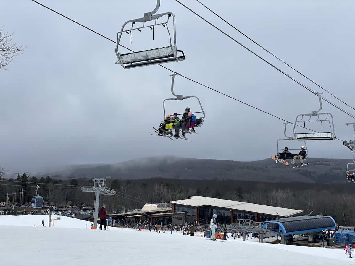 Belleayre Mountain in USA - a group of people riding a ski lift.