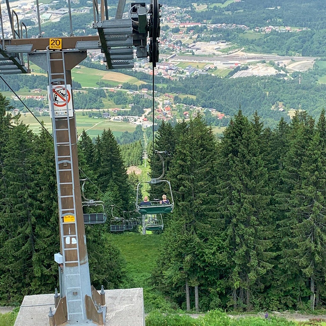 Arnoldstein Dreiländereck in Austria - a view of a ski lift going up a hill.