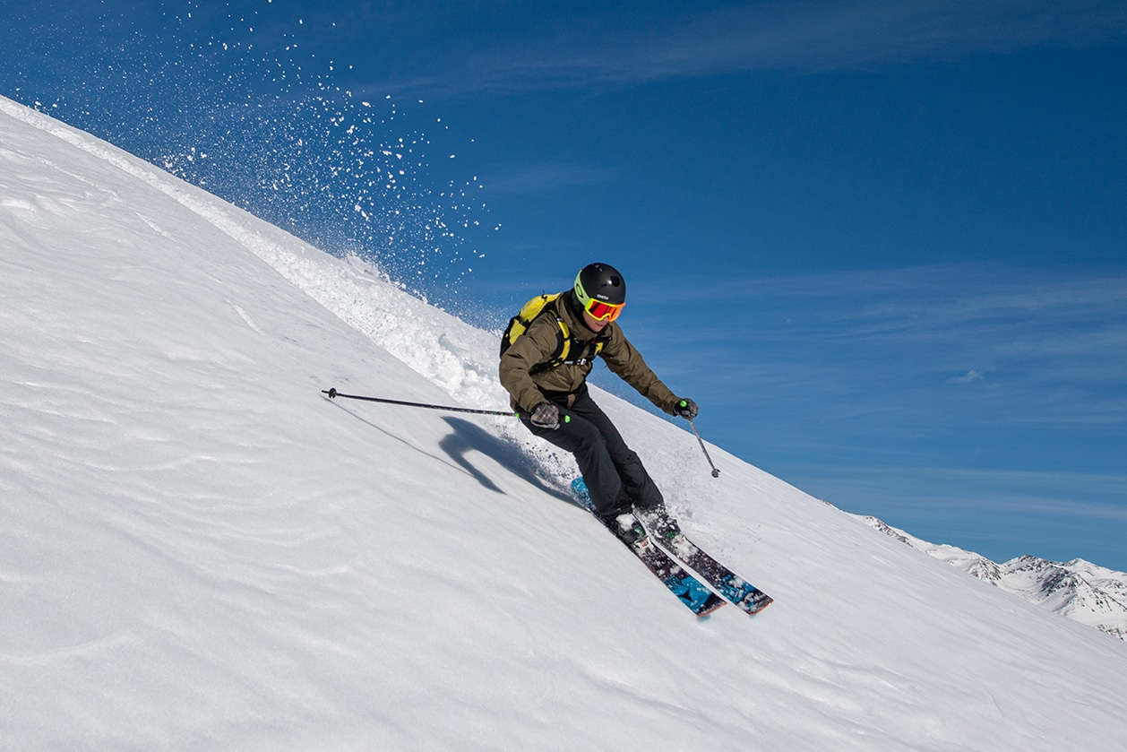 Roubion les Buisses in France - a man riding skis down a snowy slope.