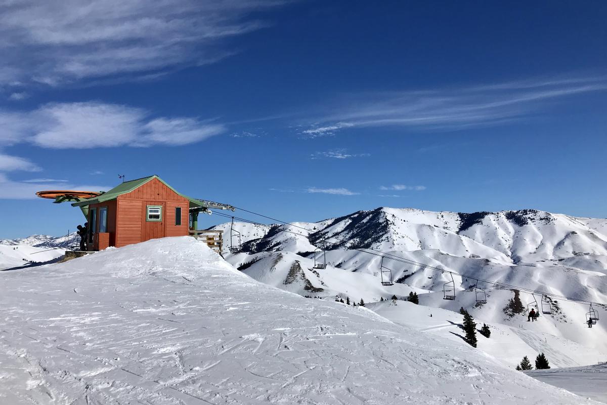 Soldier Mountain in USA - a red cabin sits on top of a snowy mountain.