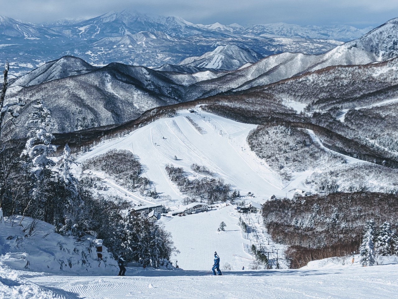 Sugadaira Kogen Taro in Japan - a person standing on top of a snow covered mountain.