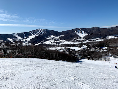 Winter sports enthusiasts enjoying a day at Sugadaira Kogen Taro ski resort in Nagano, Japan, featuring snow-covered slopes and stunning mountain scenery.