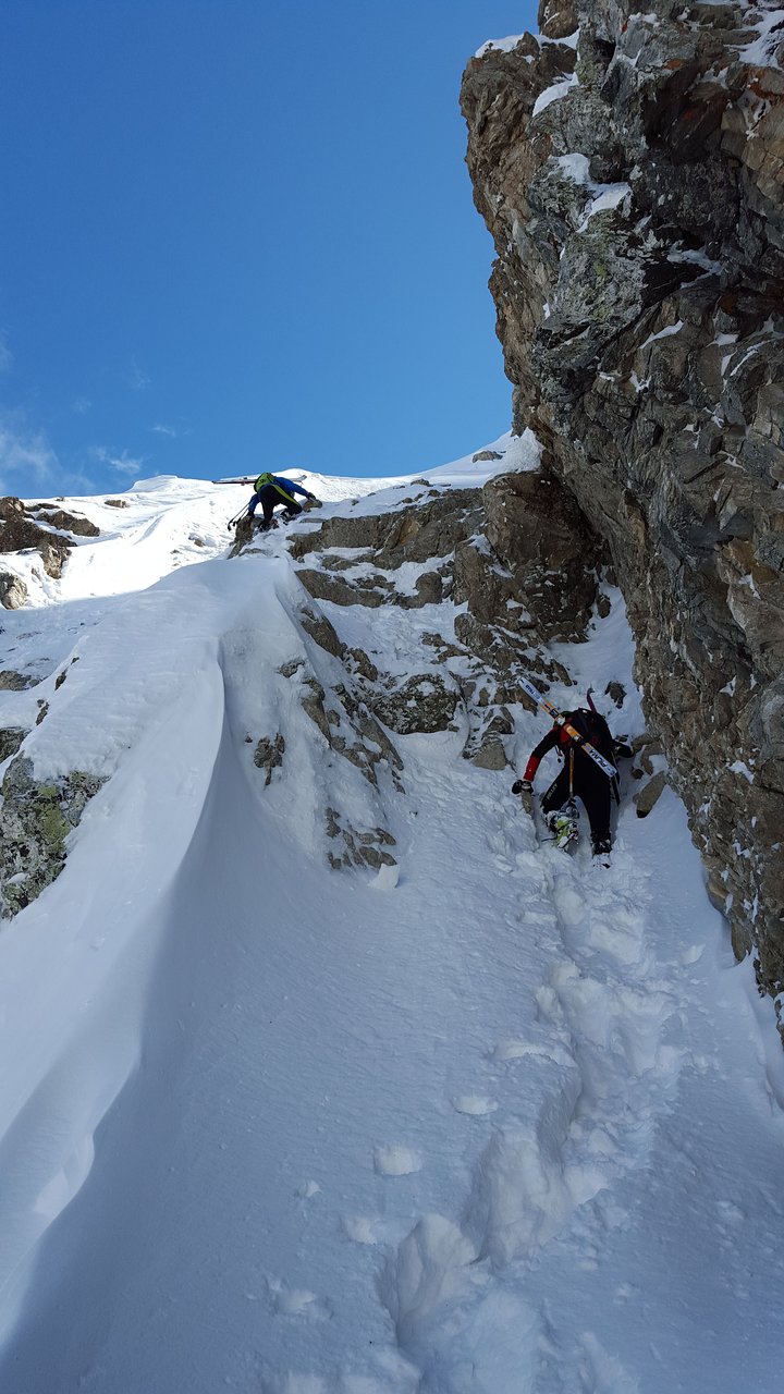 Cambre d'Aze – Eyne | ​Saint-Pierre-dels-Forcats in France - a man climbing up a snow covered mountain.