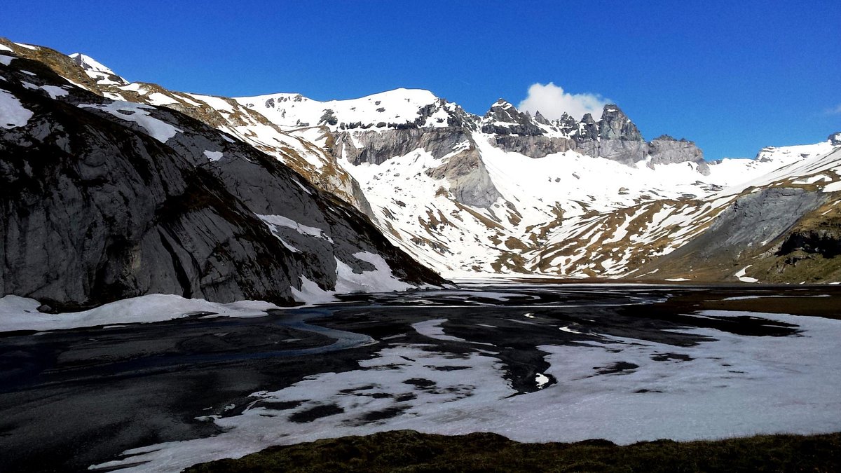 Flims Laax Falera in Switzerland - a mountain with snow on it and mountains in the background.