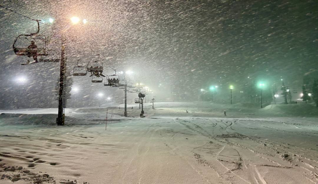 Boreal Mountain California in USA - a city street covered in snow at night.