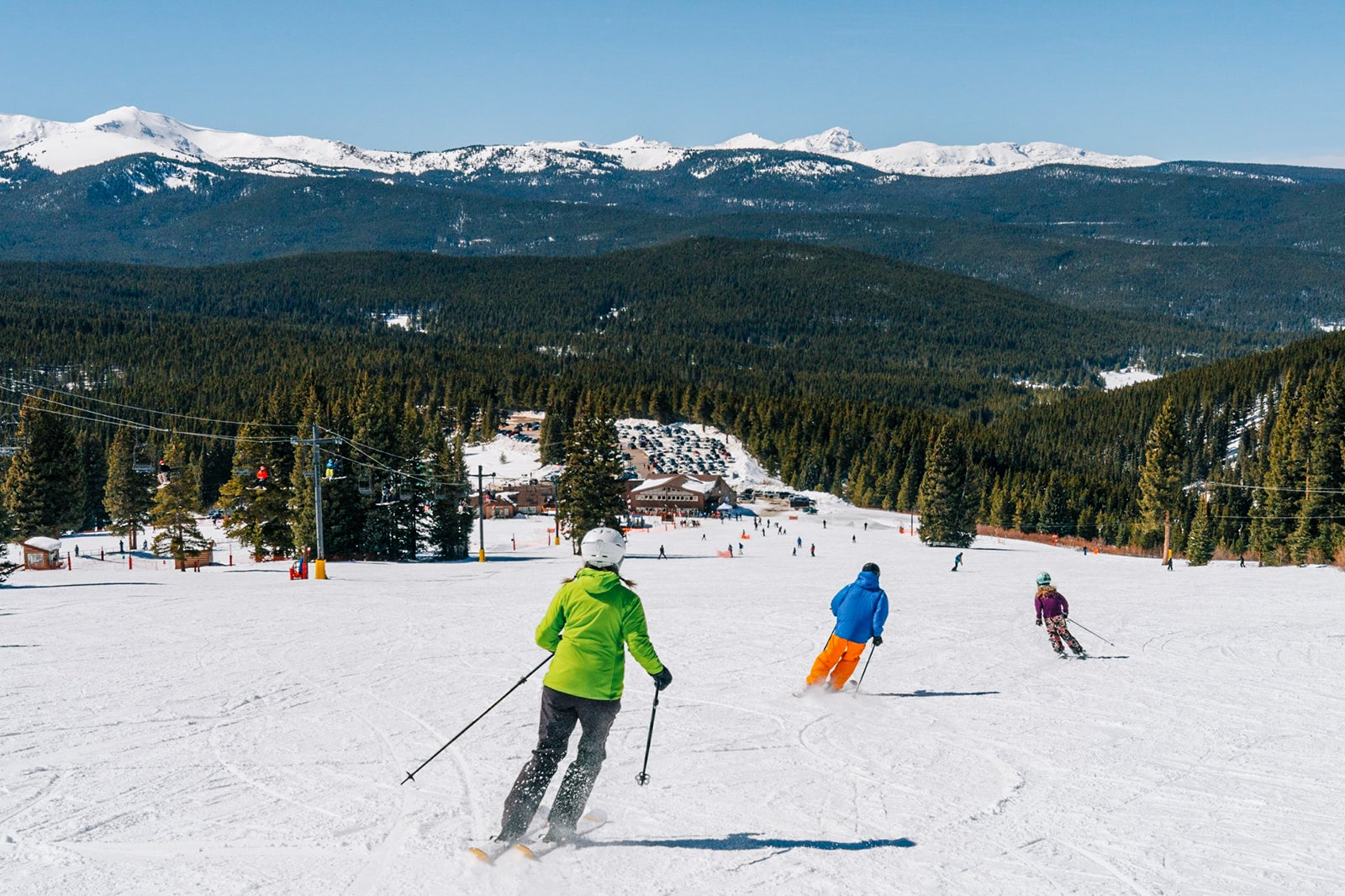 Cooper in USA - a group of people skiing down a snowy slope.