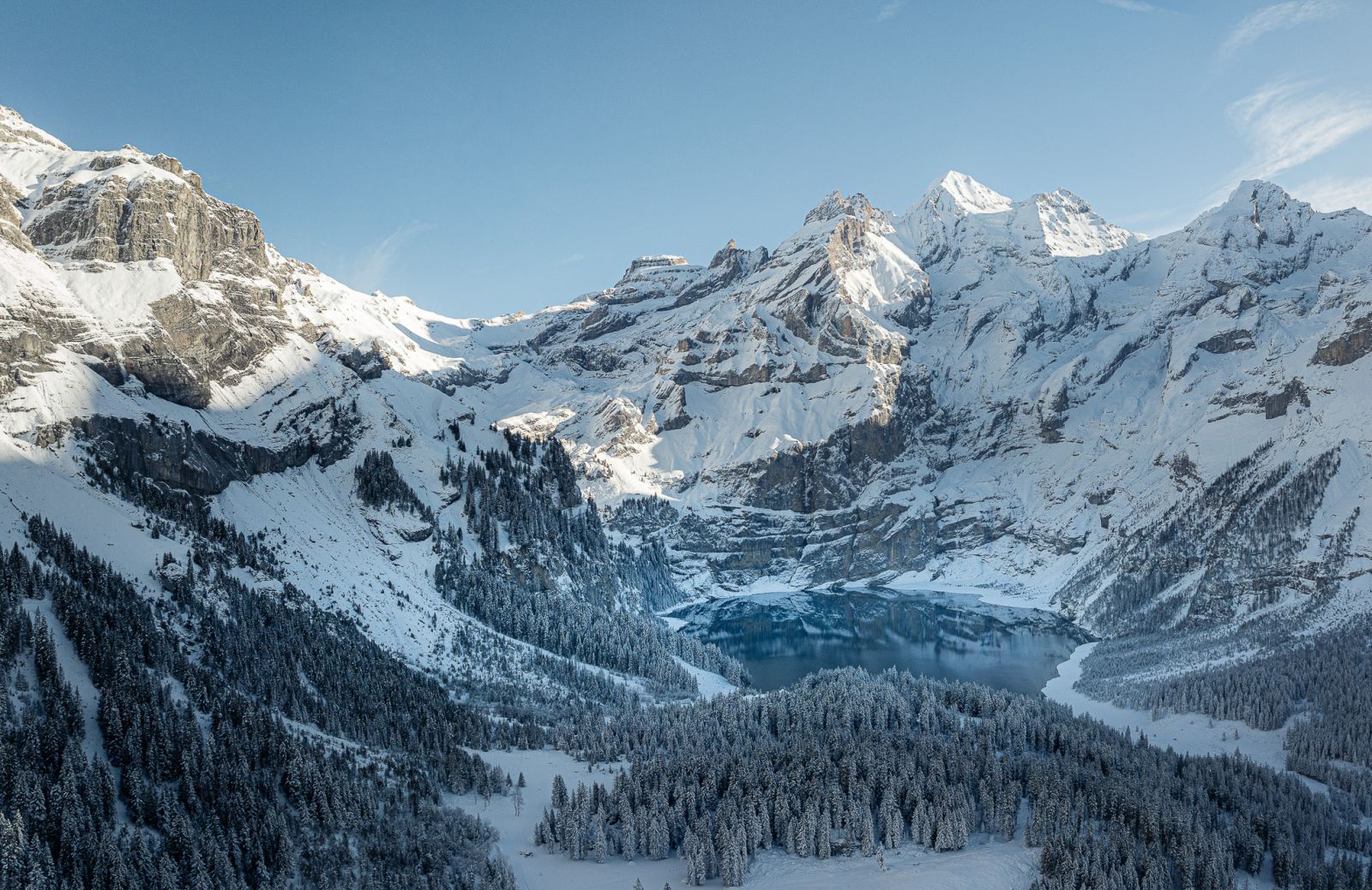 Oeschinensee in Switzerland - a snow covered mountain.