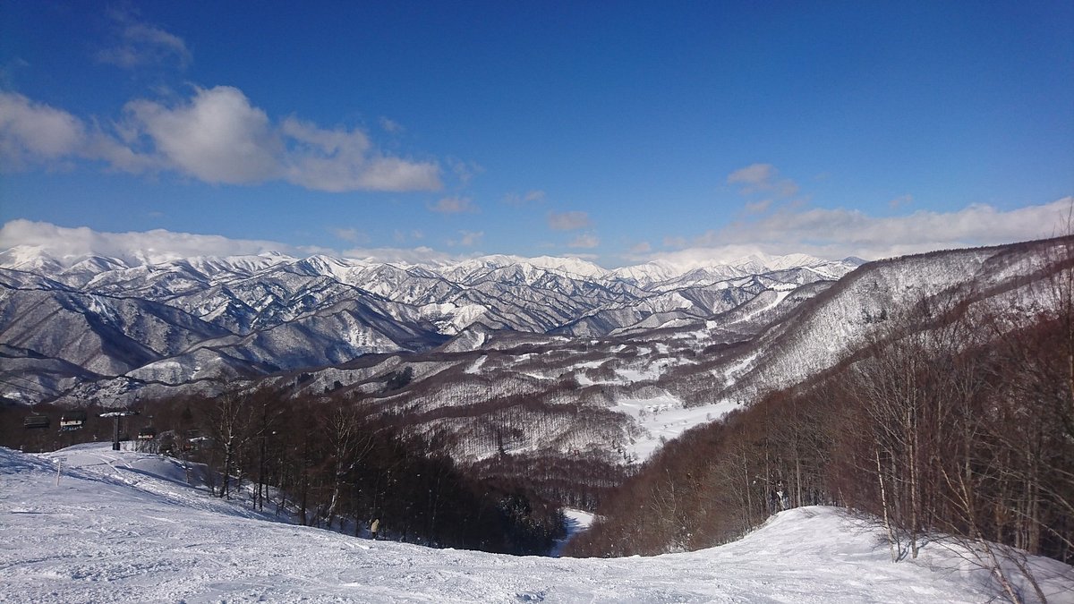 Hodaigi Ski Resort in Japan - a view of the mountains from a ski slope.
