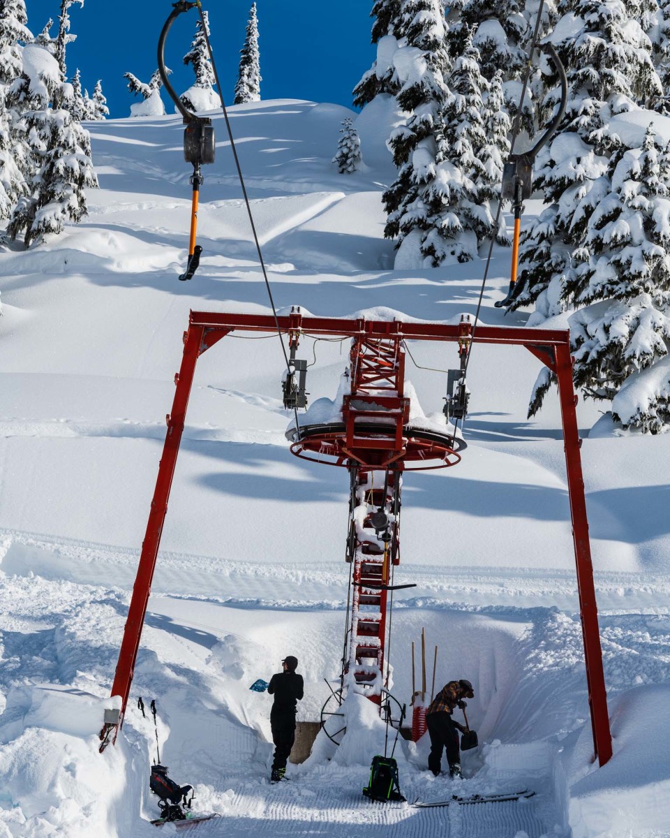 Shames Mountain in Canada - a red ski lift going up a snowy hill.