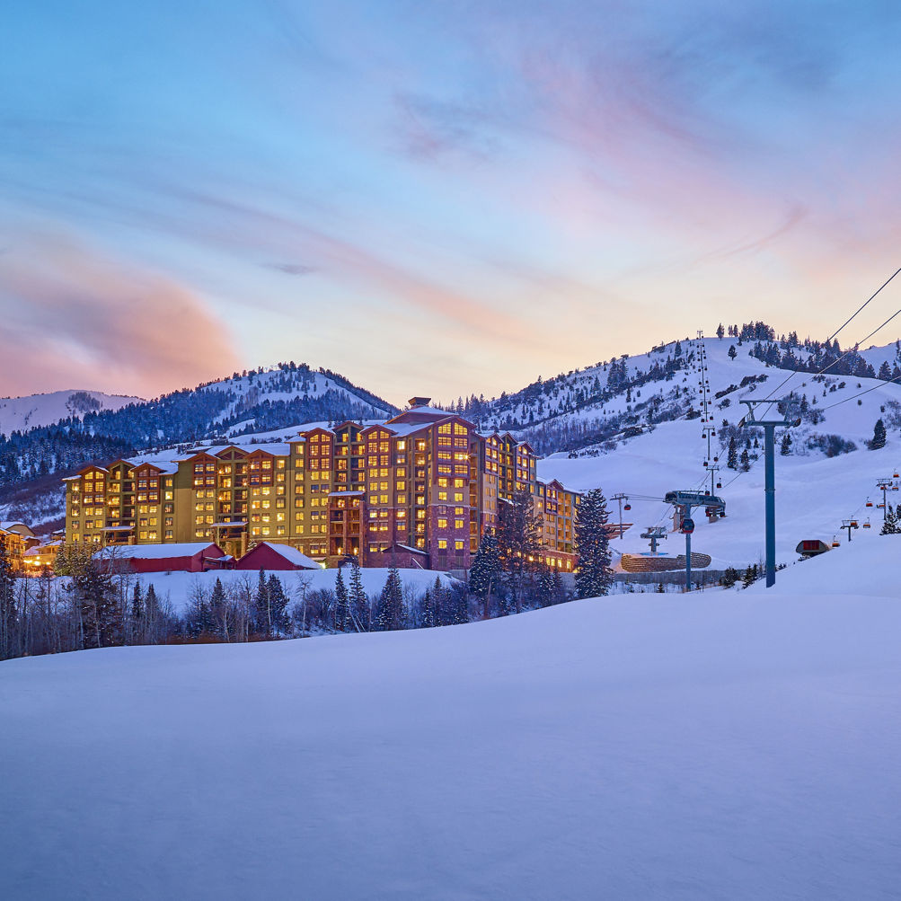 Park City Mountain in USA: a ski resort in the mountains at sunset.