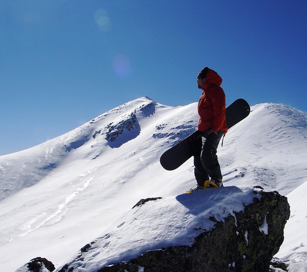 Norikura in Japan - a man standing on top of a snow covered mountain.