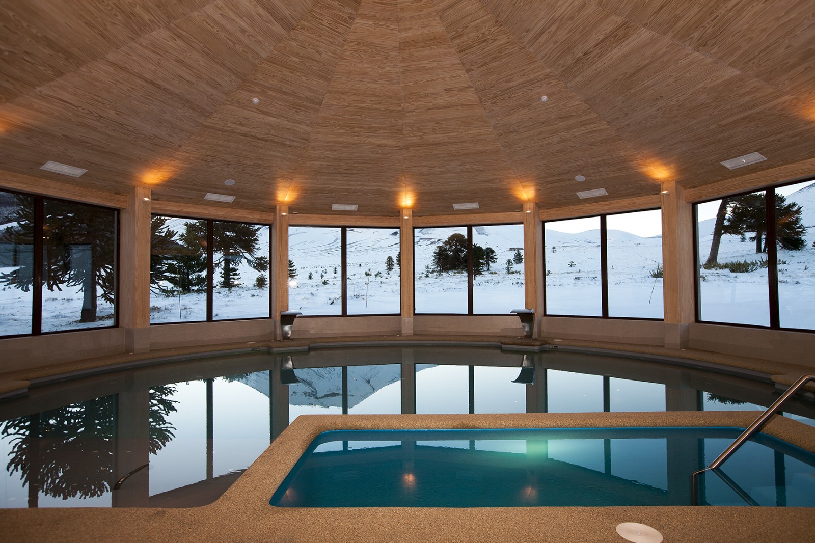 Corralco in Chile - an indoor swimming pool with a view of the mountains.