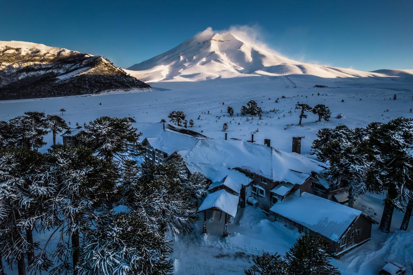 Corralco in Chile - a snow covered mountain in the background.